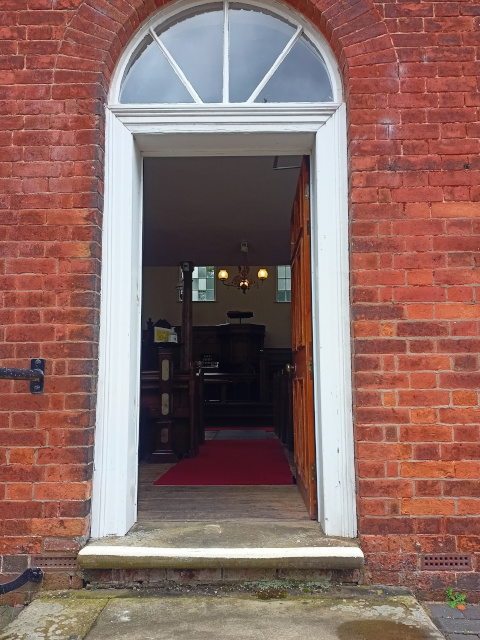 main entrance through the chapel